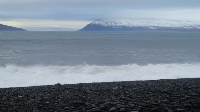 Dramatic ocean waves crashing in patagonian fjords landscape