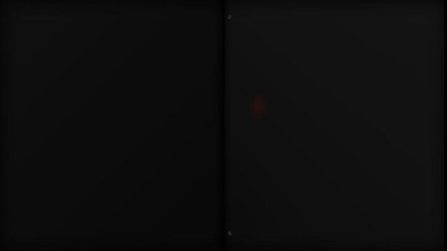 Dim red LED light glowing on electronic device screen in pitch dark room setting closeup static shot creating mysterious moody atmosphere for surveillance spy security technology background video