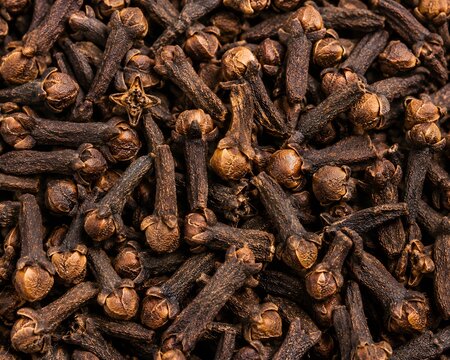 Dry aromatic organic clove spice background