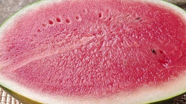 Fresh watermelon slices are arranged to create a beautiful and visually appealing backdrop.
