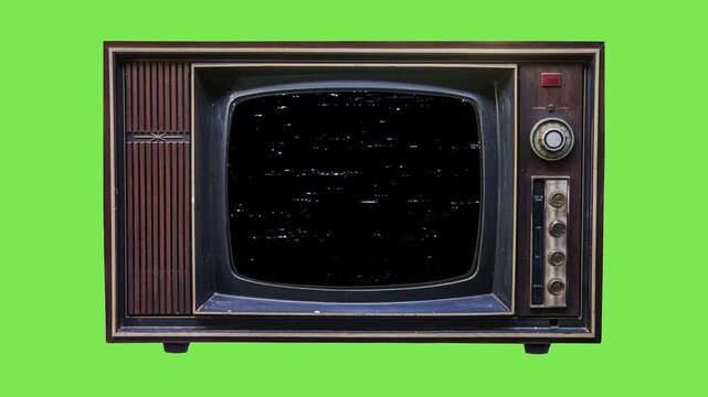 A vintage analogue television set with a fuzzy, noisy screen displaying signal interference and classic static, representing obsolete broadcast technology from a bygone era