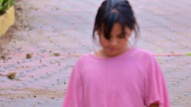 Sad Latina girl walking and slowly approaching