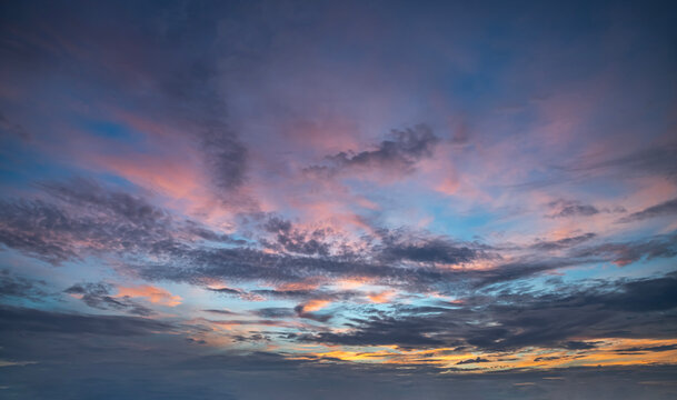 Dramatic Sunset Sky with Pink and Orange Clouds at Dusk.