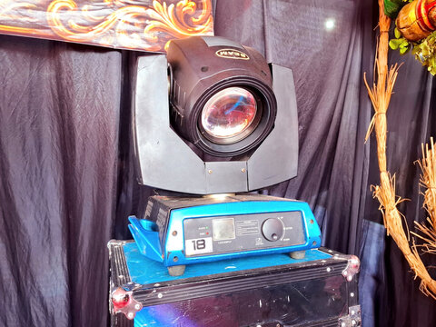 Stage beam moving head lighting equipment on blue base and black flight case for professional event production on August 8th 2026 in Magelang, Indonesia	
