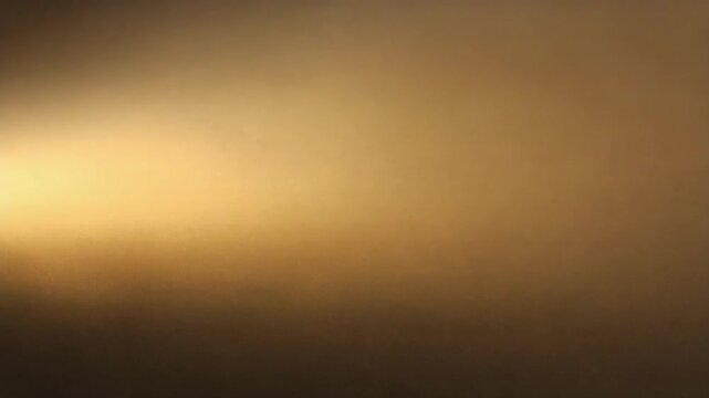 Blurred gradient background with warm golden and dark brown tones