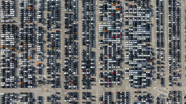 Aerial view new car lined up, Automobile automotive car parking lot commercial business industry,  Port of import export business logistic dealership, New cars global business logistic import export.