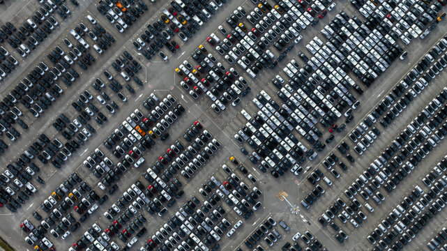 Aerial view new car lined up, Automobile automotive car parking lot commercial business industry,  Port of import export business logistic dealership, New cars global business logistic import export.