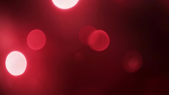 Abstract red bokeh light circles creating a soft glowing background