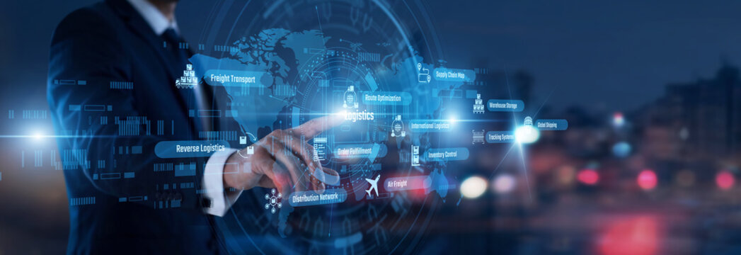 Supply chain manager hand touching Logistics words and icons on a digital map. Optimizing global shipping routes and warehouse operations to ensure timely delivery of commercial goods today.