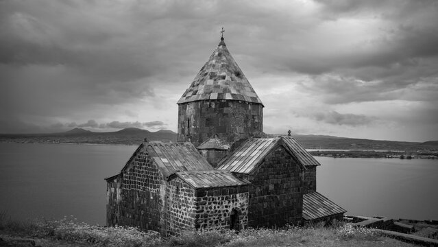 Dramatic black and white Sevanavank monastery on Lake Sevan Armenia with copy space