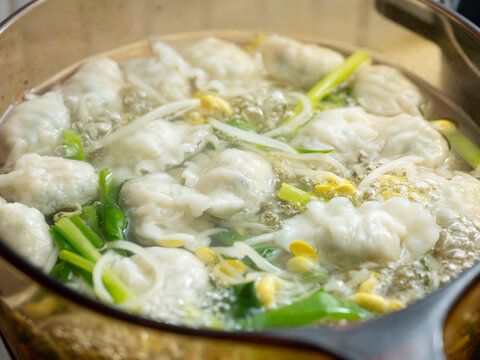 Dumpling soup in a pot