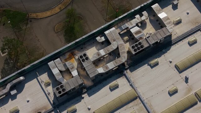 Rooftop HVAC System: An aerial view showcases the complex network of an industrial HVAC system on a building's rooftop, highlighting its functional architecture.