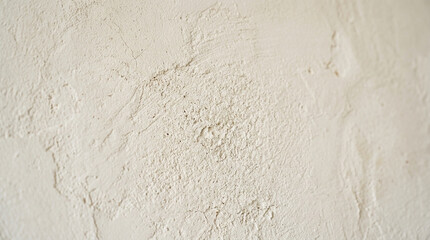 Fototapeta premium Textured plaster wall surface, beige, close-up, abstract background