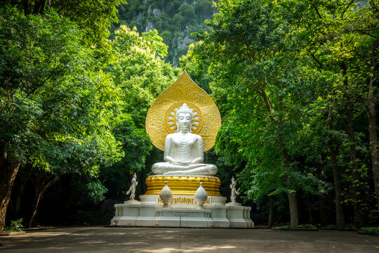 White giant buddha in a valley within Wat Tham Phra Bodhisattva in Saraburi Province, Thailand. Thai words translated as Buddha of Compassion and Meditation in English language.