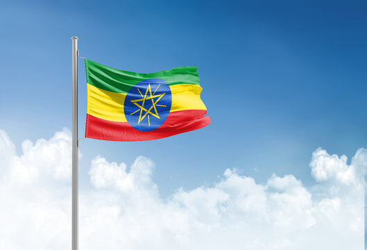 Ethiopia flag waving in beautiful sky.
