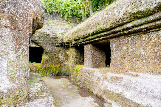 BALI, INDONESIA &ndash; OCTOBER 20, 2024: Ancient 11th-century rock-cut meditation caves and hermitage cells at Gunung Kawi Temple.