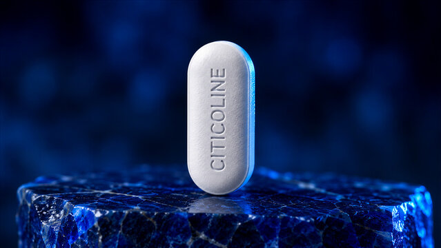 A citicoline pill stands on a rough rock surface. Blue light enhances the scene while the background remains dark. The focus is on the pill and the texture of the rock
