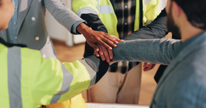 Architect, team and hand stack on construction site, partnership and unity for property development. Civil engineering, collaboration and people with design project, solidarity or support in building