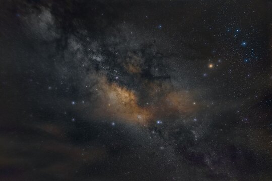 A dark Milky Way galaxy with stars in the universe.