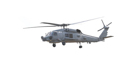 Fototapeta premium Military MH-60R Seahawk Helicopter Flying Against a Bright White Sky