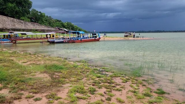 West Baray water regulator with tourist boats after rain, Siem Reap, Cambodia