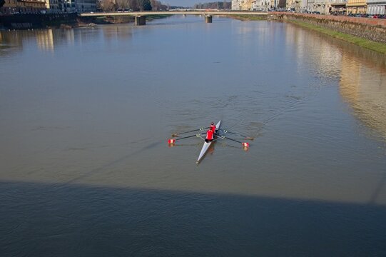Shell boat on the river in Florence Italy