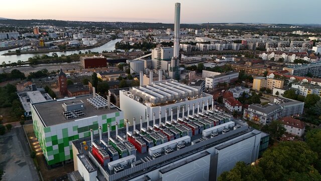 Aerial view of the Keppel Data Center Reit facility featuring modern industrial architecture and rooftop cooling units amidst the urban landscape of Offenbach am Main, Hessen, Germany.