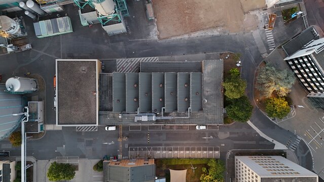 Aerial view of Keppel Data Center Reit featuring industrial buildings with flat roofs, ventilation units, and surrounding parking areas in Offenbach am Main, Hessen, Germany.