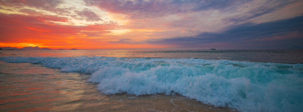 Beautiful ocean wave at sunset on tropical beach in Rio de Janeiro with copy space