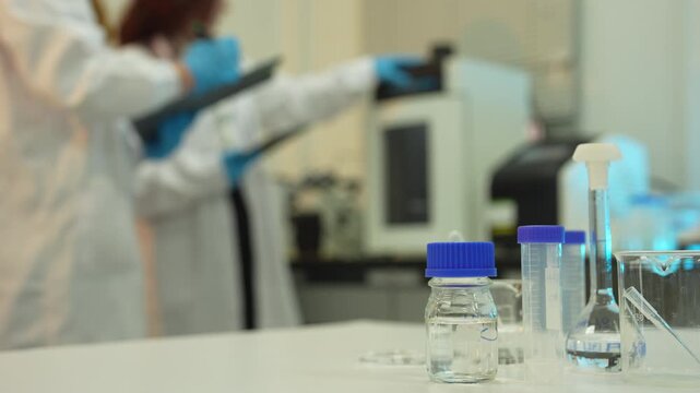 Scientists conduct chemical research and data analysis in a modern laboratory, driving innovation, biotechnology, healthcare, and scientific discovery through teamwork.