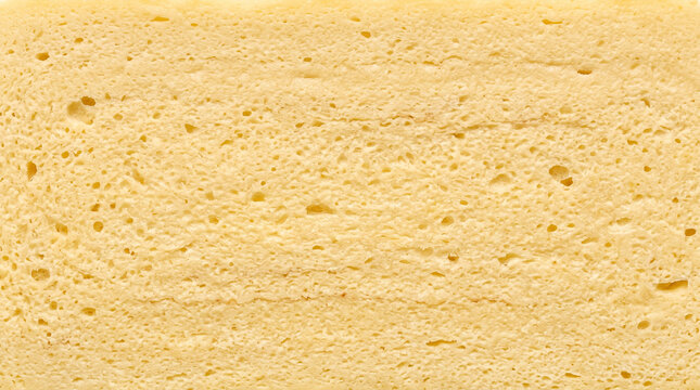 Fine aerated cooked egg-protein matrix forming a soft layered golden omelet structure with Close Up