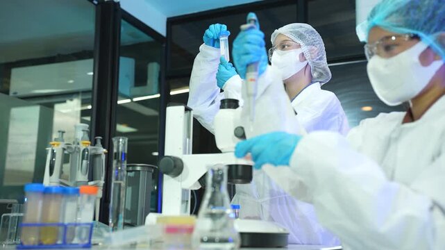 Scientists conduct chemical research and data analysis in a modern laboratory, driving innovation, biotechnology, healthcare, and scientific discovery through teamwork.