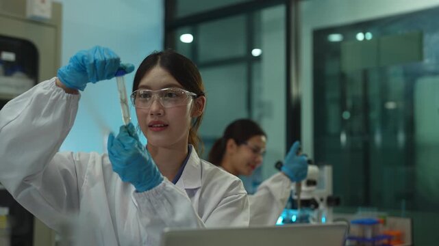 Researcher testing water purity with microscope and petri dish culture samples in a sterile clean room laboratory, highlighting science, microbiology, analysis, and quality control.