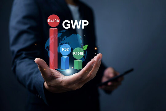 Businessman holding Global Warming Potential GWP chart comparing R410A R32 and R454B refrigerants