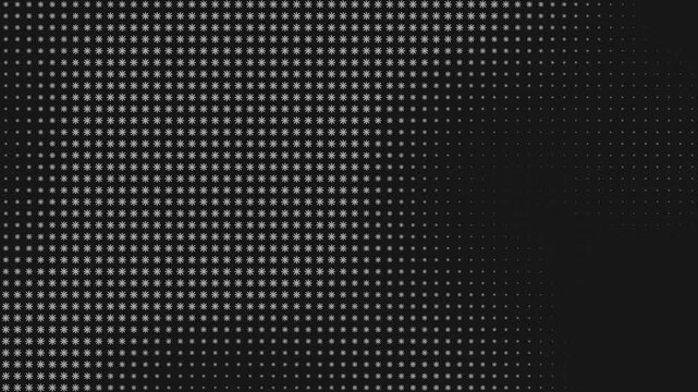 Abstract geometric pattern of pulsating white snowflake icons on black background. Loop. 4K