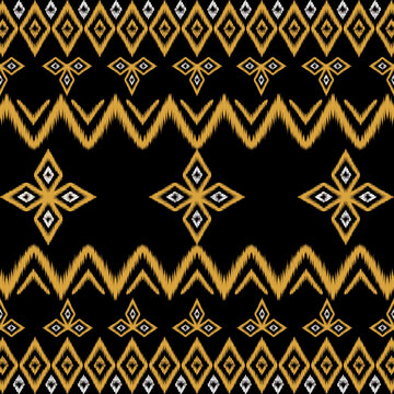 Elegant black and gold ikat-inspired geometric textile pattern featuring repeating diamond, zigzag and ornamental motifs.