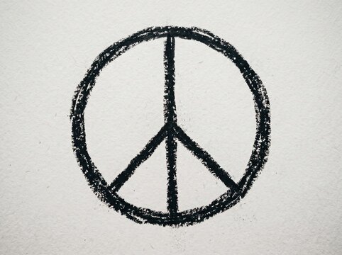 Hand drawn peace sign symbol on white paper with black and white, movement