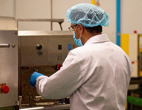 Professional industrial scene featuring modern production equipment inside an Indian manufacturing facility, emphasizing engineering, automation, efficiency, and scale.