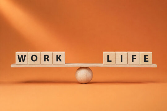Work life balance concept. Wooden cube block with word WORK and LIFE on seesaw.
