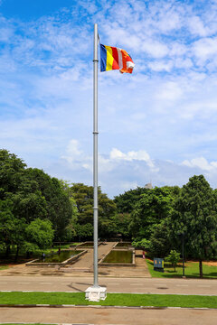 Buddhist flag flying high on a flagpole at Independence Square in Colombo, Sri Lanka.