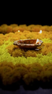Clay diya lamps lit during diwali celebration, Diwali, or Deepavali, is India's biggest and most important holiday.