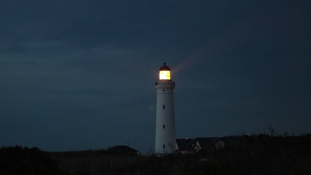 Hirtshals, Denmark A night view of the Hirtshals Fyr, or Hirtshals Lighthouse, and light beam.  