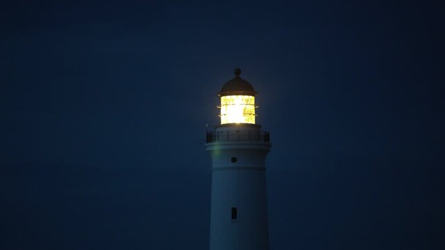 Hirtshals, Denmark A night view of the Hirtshals Fyr, or Hirtshals Lighthouse, and light beam.  
