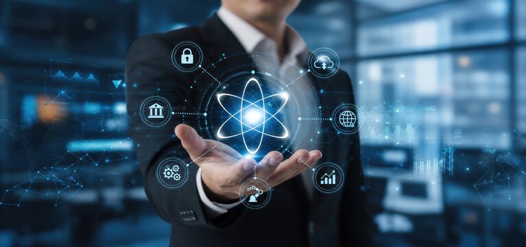 Futuristic atom icon hologram in businessman hand, AI data network interface, blue tech background