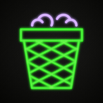 Green neon trash can silhouette with paper scrap elements for waste management or office cleanup digital icon graphic design isolated on dark fabric.