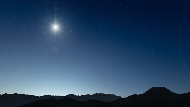 Glowing Christmas star above a peaceful mountain landscape