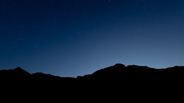 Glowing Christmas star above a peaceful mountain landscape