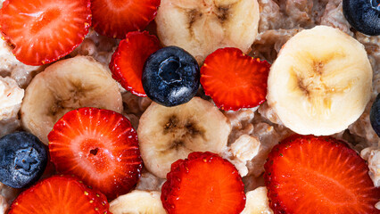 Fruits in a plate isolated on white background. Strawberry, blueberry and banana on white background. © Светлана Гуркова