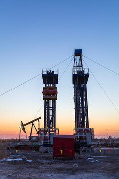 In the evening, oil pumps are running, Silhouette of beam pumping unit