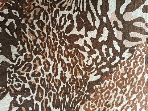 Animal print fabric texture background with leopard and tiger patterns